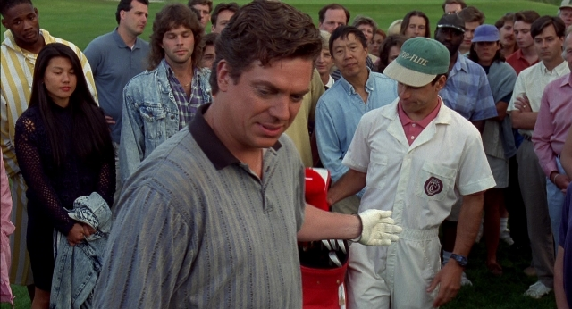 Wide shot frame from Happy Gilmore — standing, dress, shirt