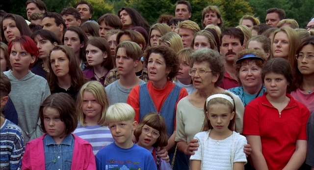 Wide shot frame from Happy Gilmore — standing, person, human face