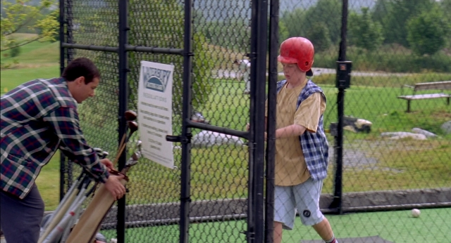 Frame from Happy Gilmore — standing, hat, shirt