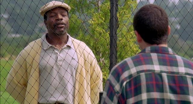 Wide shot frame from Happy Gilmore — standing, shirt, beard