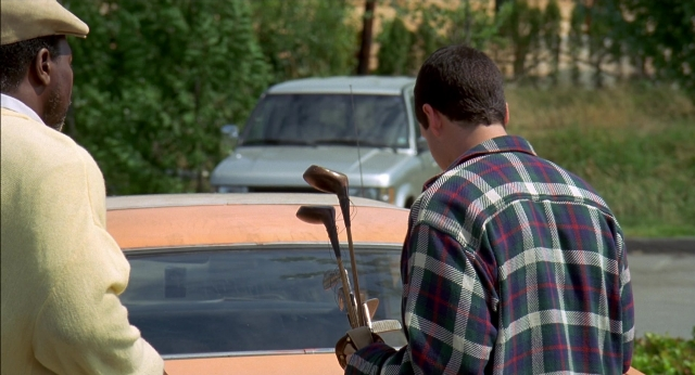 Wide shot frame from Happy Gilmore — standing, car, shirt