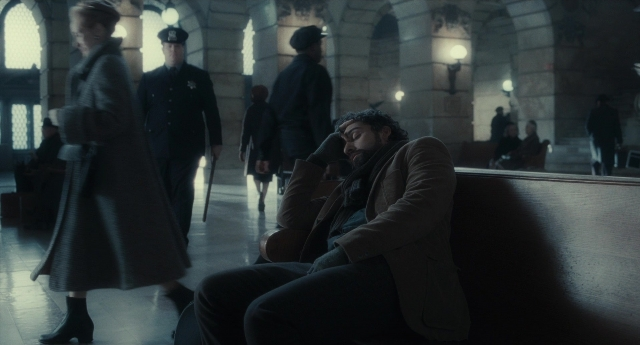 Wide shot frame from Inside Llewyn Davis — sitting, walking, coat