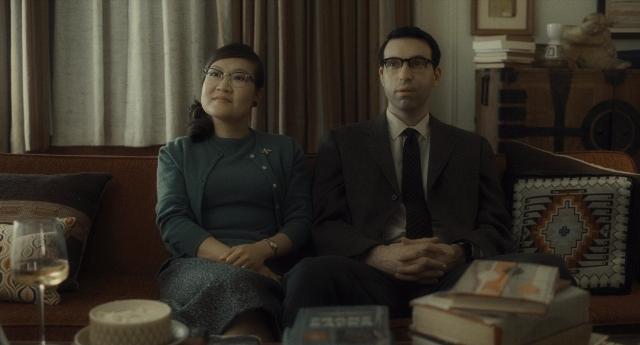 Wide shot frame from Inside Llewyn Davis — sitting, plate, room