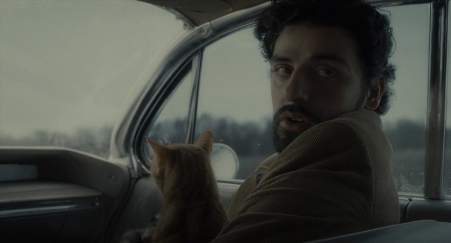 Medium shot frame from Inside Llewyn Davis — sitting, car, beard