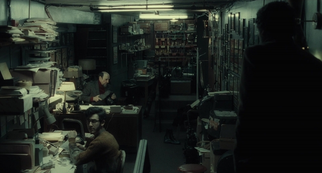 Wide shot frame from Inside Llewyn Davis — sitting, room, office