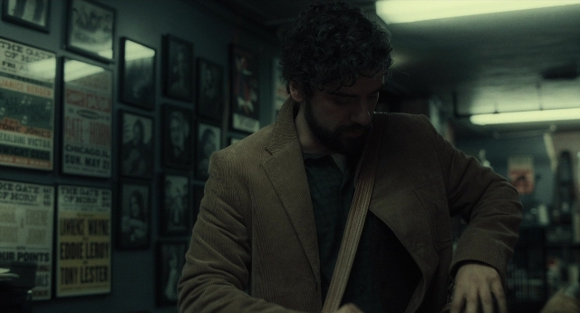 Wide shot frame from Inside Llewyn Davis — standing, room, coat