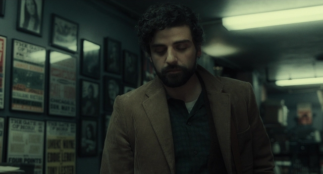 Medium shot frame from Inside Llewyn Davis — standing, room, suit
