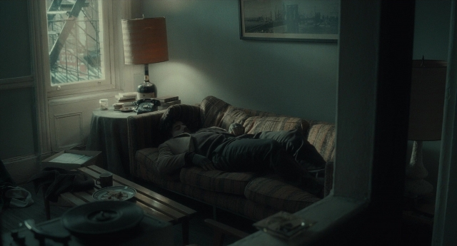 Frame from Inside Llewyn Davis — room, table, phone
