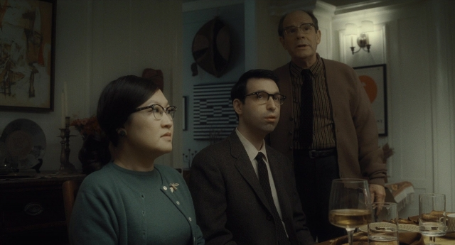 Wide shot frame from Inside Llewyn Davis — sitting, standing, room