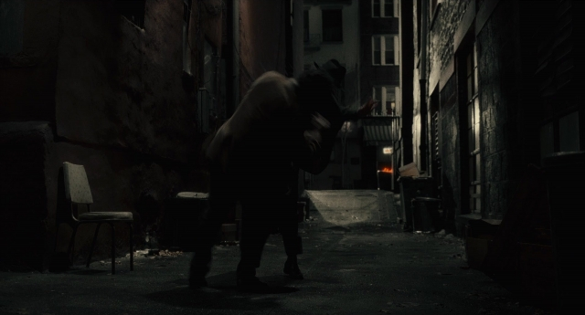 Wide shot frame from Inside Llewyn Davis — walking, hat, fire