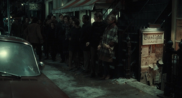 Medium shot frame from Inside Llewyn Davis — standing, dialogue, street