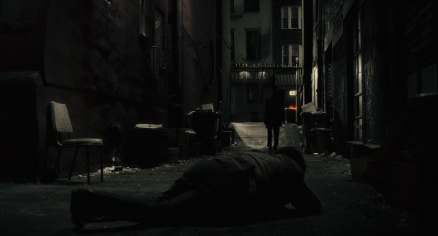 Wide shot frame from Inside Llewyn Davis — walking, street, coat