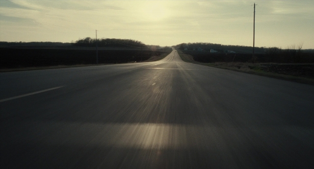Frame from Inside Llewyn Davis — street, running, pay phone