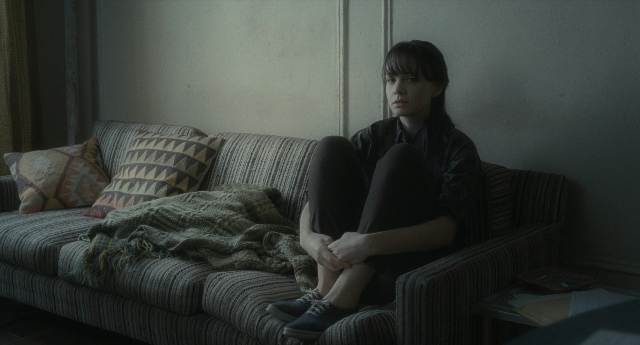Wide shot frame from Inside Llewyn Davis — sitting, room, shirt