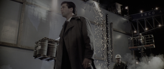 Wide shot frame from The Hunt for Red October — standing, coat, hand