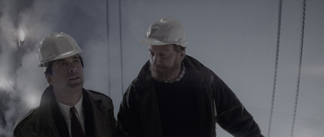 Wide shot frame from The Hunt for Red October — standing, room, hat