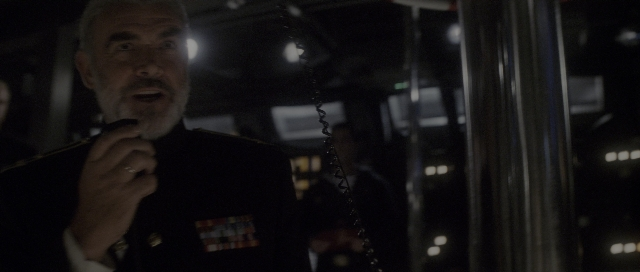 Wide shot frame from The Hunt for Red October — dialogue, phone, uniform