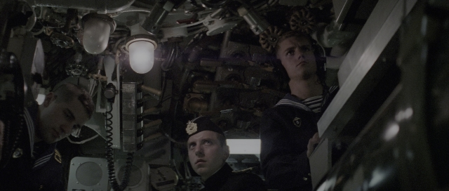 Medium shot frame from The Hunt for Red October — standing, face, person