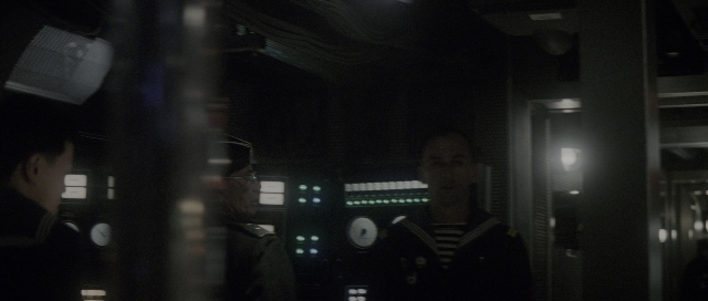 Wide shot frame from The Hunt for Red October — room, dialogue, person
