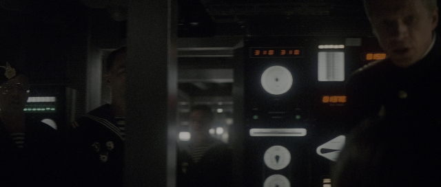 Wide shot frame from The Hunt for Red October — room, clock, person