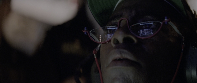Wide shot frame from The Hunt for Red October — hat, face, person