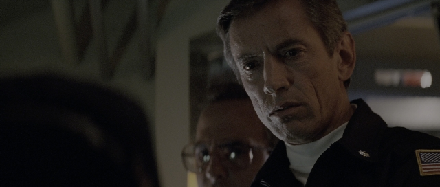 Frame from The Hunt for Red October — suit, face, hair