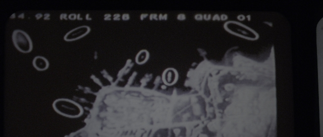 Wide shot frame from The Hunt for Red October — phone, face, person