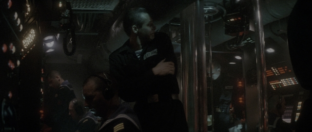 Wide shot frame from The Hunt for Red October — standing, room, face