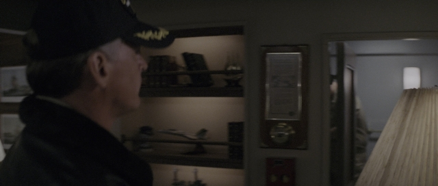 Wide shot frame from The Hunt for Red October — standing, room, door