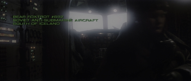 Wide shot frame from The Hunt for Red October — airplane, person, human face