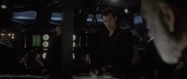 Wide shot frame from The Hunt for Red October — standing, room, phone