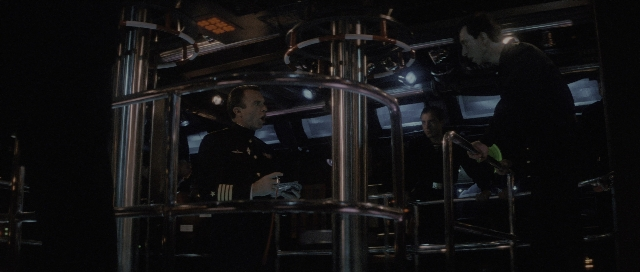 Wide shot frame from The Hunt for Red October — standing, room, dialogue