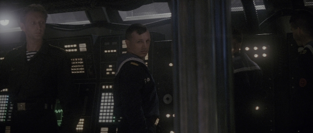 Wide shot frame from The Hunt for Red October — standing, room, face