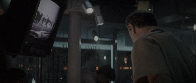 Wide shot frame from The Hunt for Red October — standing, room, person