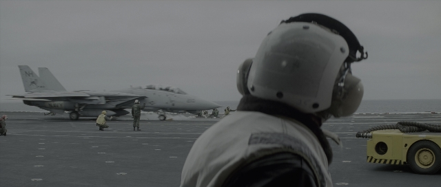 Wide shot frame from The Hunt for Red October — hat, fight, airplane