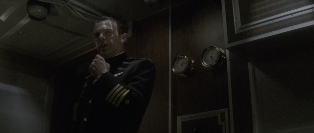 Wide shot frame from The Hunt for Red October — standing, room, uniform