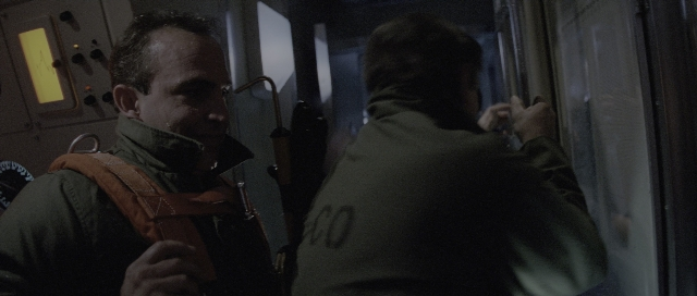 Wide shot frame from The Hunt for Red October — standing, room, face