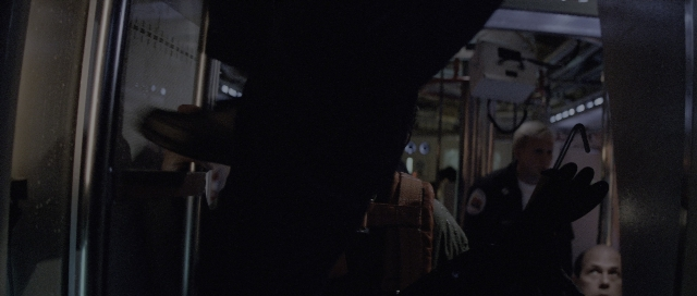 Wide shot frame from The Hunt for Red October — door, hand, night