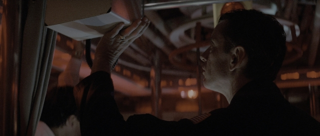 Wide shot frame from The Hunt for Red October — standing, room, face
