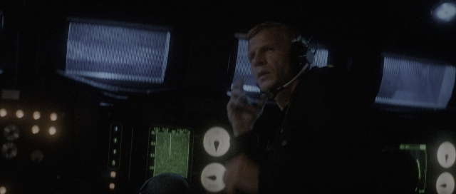Wide shot frame from The Hunt for Red October — standing, room, hand