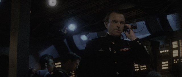 Wide shot frame from The Hunt for Red October — standing, room, dialogue