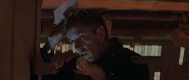 Wide shot frame from The Hunt for Red October — room, uniform, hand