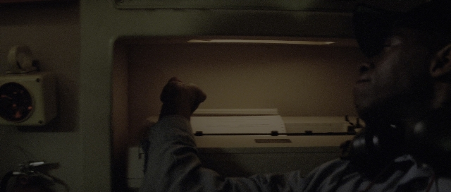 Wide shot frame from The Hunt for Red October — sitting, room, phone