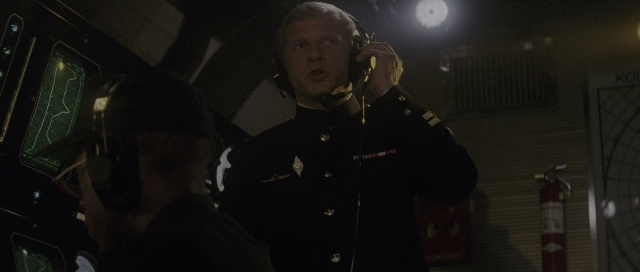 Wide shot frame from The Hunt for Red October — standing, room, dialogue