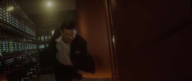 Wide shot frame from The Hunt for Red October — walking, room, suit