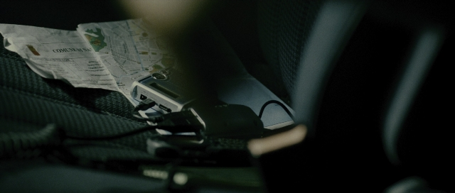 Wide shot frame from The Bourne Supremacy — car, hand, person