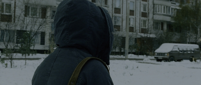 Wide shot frame from The Bourne Supremacy — street, bag, snow