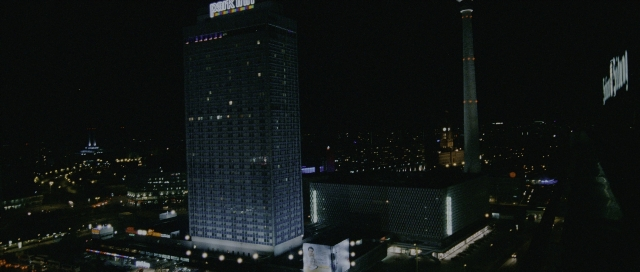Wide shot frame from The Bourne Supremacy — night, tower, skyscraper