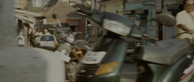 Wide shot frame from The Bourne Supremacy — standing, walking, plate