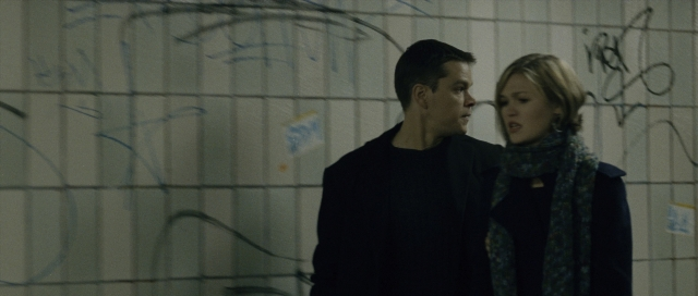 Wide shot frame from The Bourne Supremacy — standing, dialogue, person
